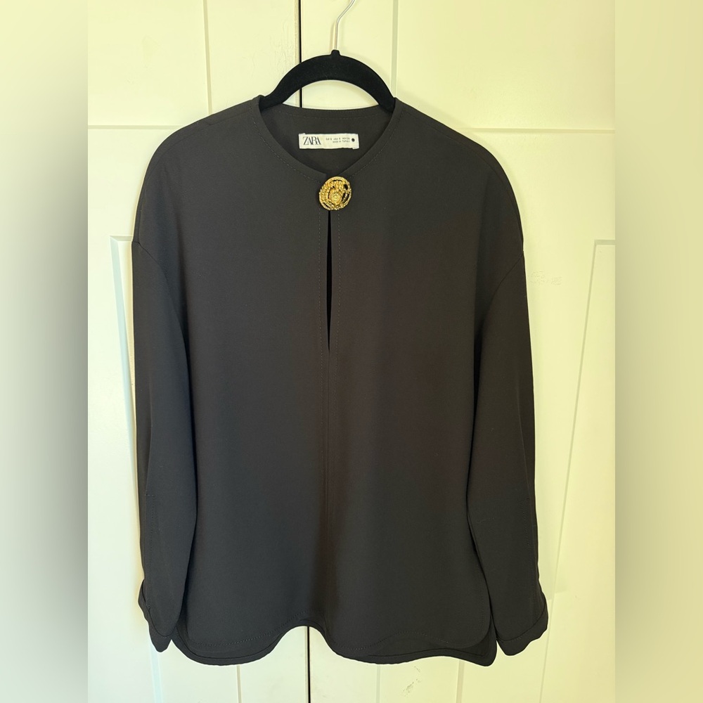 NWOT Zara Black Blouse with Gold Decorative Brooch size Small.